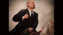 a painting of a man in a suit and tie holding a red flag