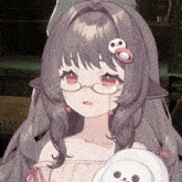 a girl wearing glasses has a skull on her hair