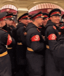 a group of men in black uniforms with the number 8 on their sleeves