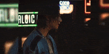 a painting of a person 's face is displayed in a pixel art style