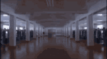 a man is walking through a door with the word pinged written on it