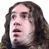 a man with long curly hair has a nose ring in his nose