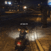 a group of motorcycle riders are riding down a street at night with john tejedor ( 13 ) simon pareja vagos mc