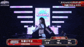 a woman is dancing in front of a sign that says kurara