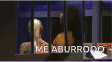 a woman behind bars with the word me aburrooo on the bottom