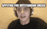 a man wearing headphones with the words applying for outstanding orcas written above him .