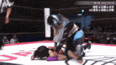 two women are wrestling in a ring with jpw written on the bottom of the screen