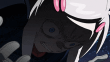 a close up of a cartoon character 's face with the letter n on her head