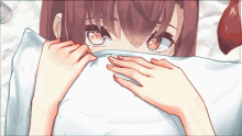 a close up of a girl covering her face with a white pillow