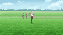 a person running on a grassy field with a number 16 on their shirt