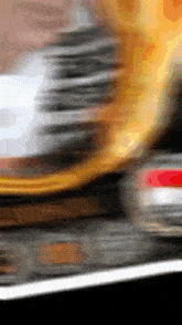 a blurred image of a car with a red tail light