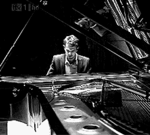 Theo James Sat At A Piano GIF - Theo James Sat At A Piano Music Notes GIFs