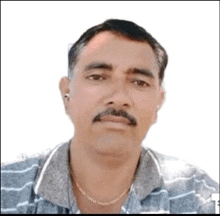 a man with a mustache and ear buds is wearing a striped shirt and a chain around his neck .