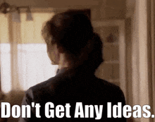 a woman 's back is shown with the words " do n't get any ideas " on the bottom