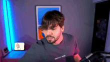 a man with a beard wearing a mentally gone shirt