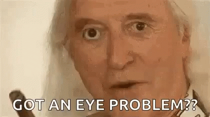 a close up of an older man 's face with the words `` got an eye problem '' written on it .