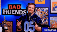 a man wearing headphones and a jersey with the number 05