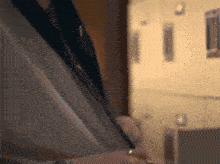 a close up of a person 's torso with a ring on their finger