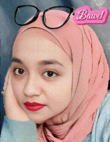 a woman wearing glasses and a hijab with the word bawel on the bottom