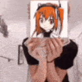 a person is holding a picture of an anime girl on their face .