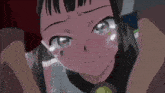 a close up of a girl 's face with tears running down her cheeks