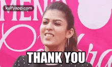 a woman is making a face and saying `` thank you '' .