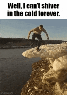 a man is standing on top of a large piece of ice .