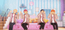 a group of anime characters are sitting on a bed in a room