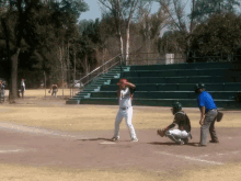 a baseball player wearing a jersey that says ' aguilas ' on it