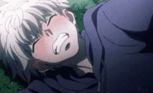 a close up of a person laying down with their eyes closed and their mouth open .