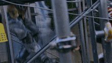 a blurred image of a fence with a blue light behind it