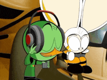 a green cartoon character wearing headphones next to another cartoon character