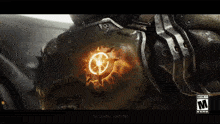 a close up of a video game character 's chest with a glowing logo on it .