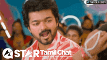 a man in a red shirt is on a star tamil chat screen