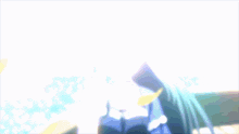 a blurred image of a girl with long hair standing in front of the ocean