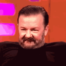 Ricky Gervais Smile GIF - Ricky Gervais Smile Lip Bite GIFs