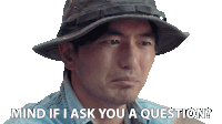 a man wearing a hat and a denim shirt says mind if i ask you a question