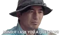 a man wearing a hat and a denim shirt says mind if i ask you a question