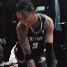 a man in a basketball uniform with the number 9 on it