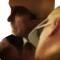 a blurry picture of a man in a suit and tie talking on a cell phone