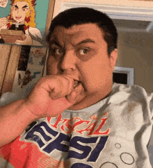 a man wearing a shirt that says pepsi