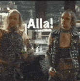 a couple of men standing next to each other with alla written on the bottom