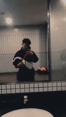 a man taking a selfie in front of a mirror