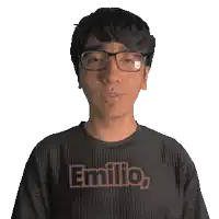 a man wearing glasses and a black shirt that says emilio on it