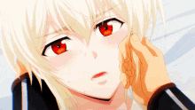 a close up of a person touching a girl 's face with red eyes