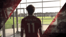 a soccer player with the number 11 on his shirt