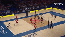 a volleyball game is being played in lodz