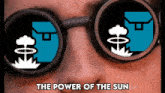 a person wearing sunglasses with the words the power of the sun written below them