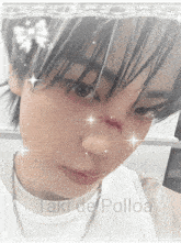 a close up of a person 's face with the words taki de polloa on the bottom right