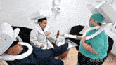 a gif from gifrun.com shows a doctor and a nurse